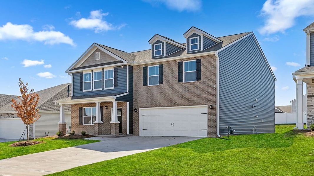 Front exterior of a new home in Durbin Meadows Traditions, Fountain Inn, SC, highlighting curb appeal (Image 2).