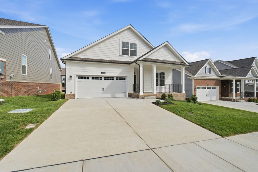 Front exterior of a new home in McCain's Station, Gallatin, TN, highlighting curb appeal (Image 26). Front exterior of a new home in McCain's Station, Gallatin, TN, highlighting curb appeal (Image 26).