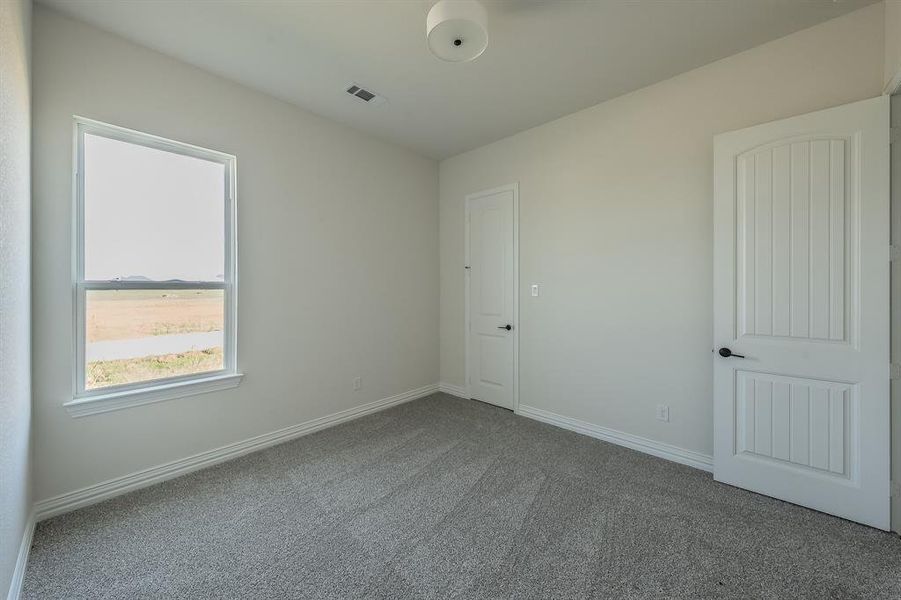 Spacious, unfurnished interior of a new home in Matthews Farms, Venus (Image 19).