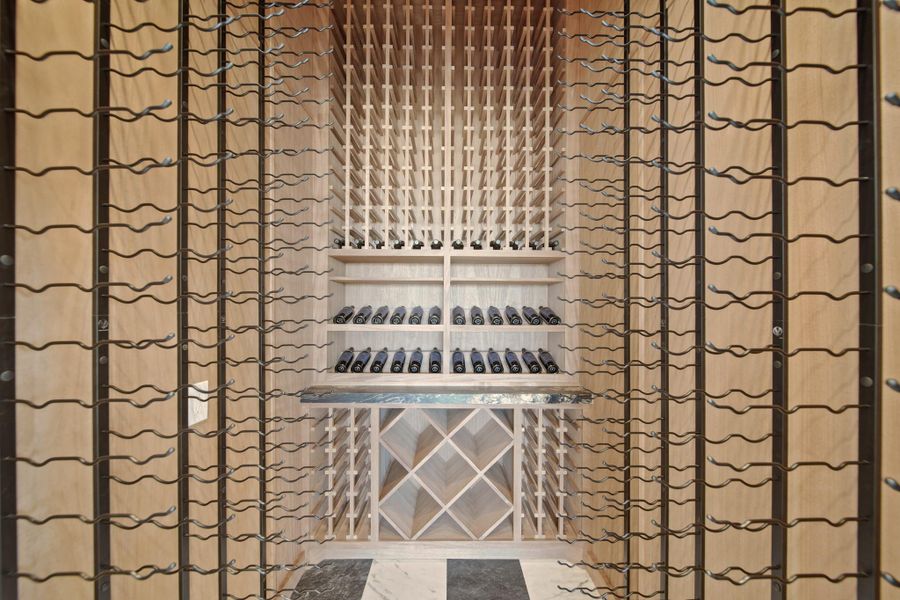 Massive temperature controlled custom wine room, which can hold over 800 bottles.