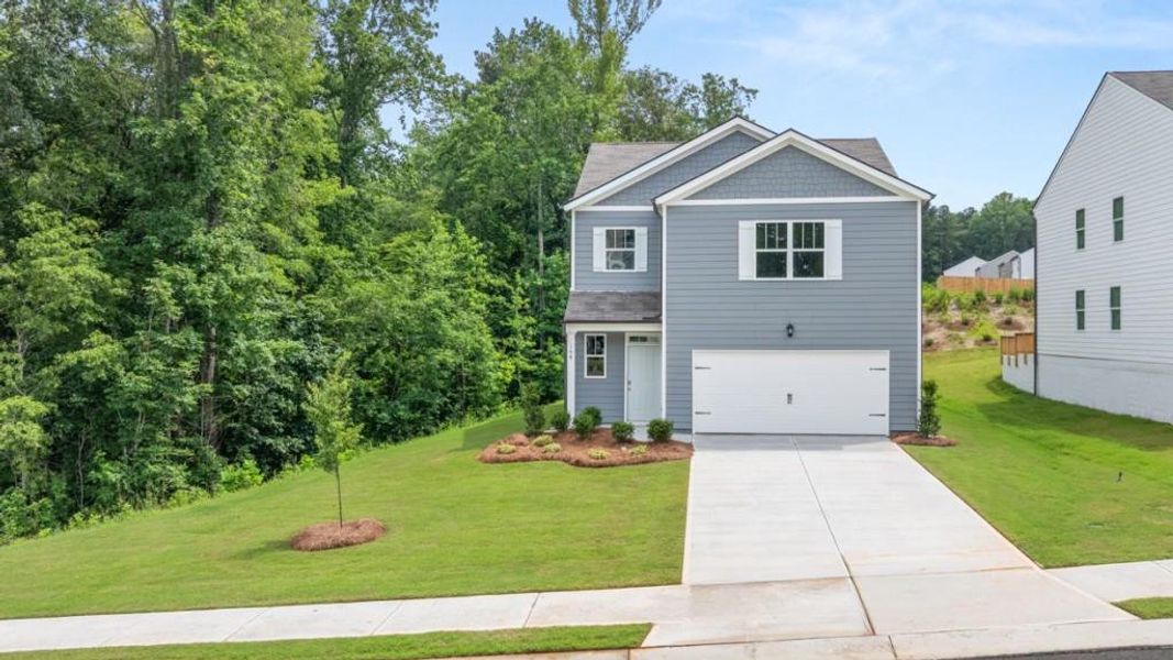 Front exterior of a new home in Oakleigh Glen, Dallas, GA, highlighting curb appeal (Image 2). Front exterior of a new home in Oakleigh Glen, Dallas, GA, highlighting curb appeal (Image 2).