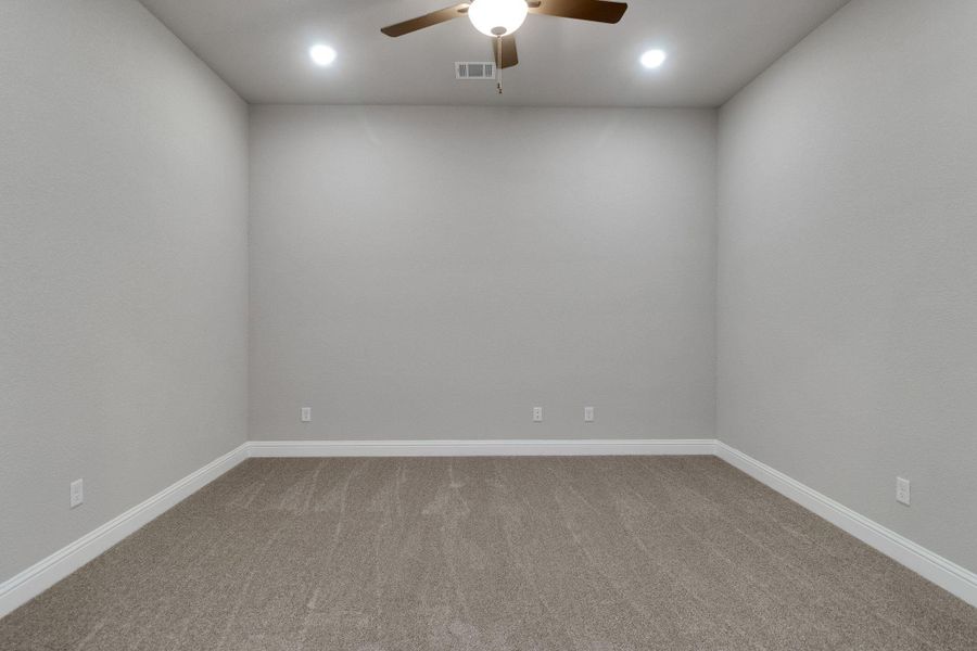 Unfurnished room featuring ceiling fan, carpet flooring, recessed lighting, and visible vents