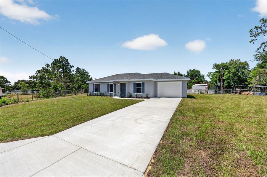 Front exterior of a new home in , Ocala, FL, highlighting curb appeal (Image 19). Front exterior of a new home in , Ocala, FL, highlighting curb appeal (Image 19).