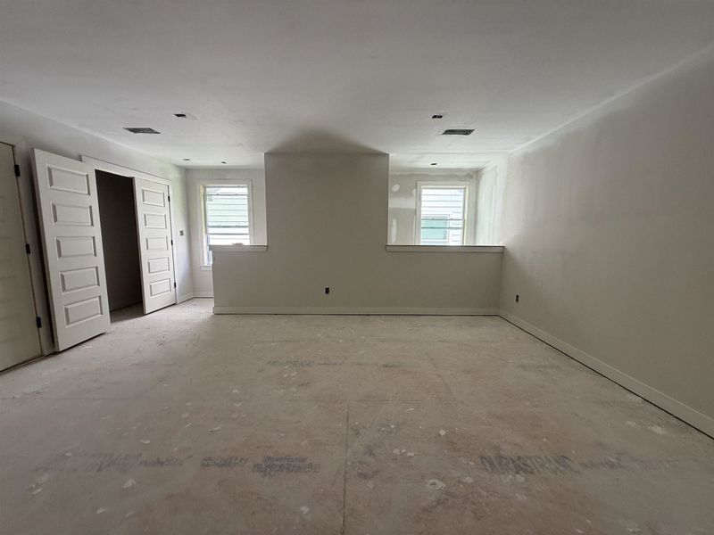 Spare room featuring healthy amount of natural light