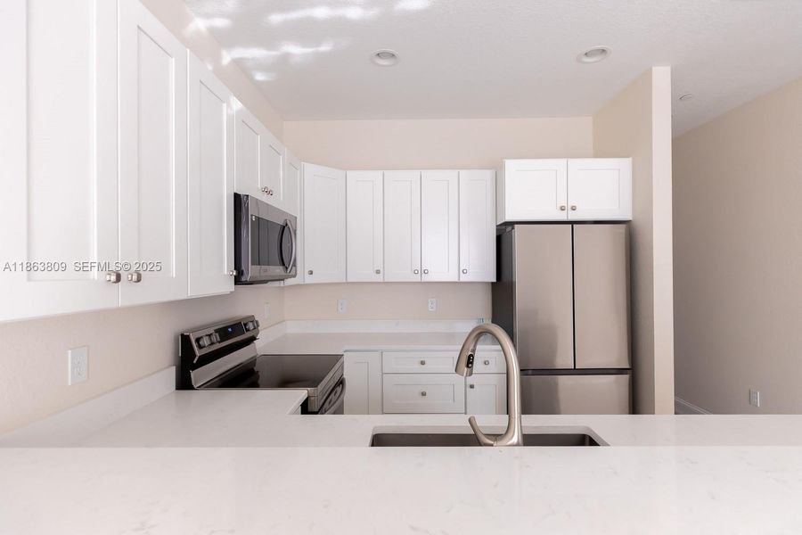 Furnished interior view inside a new home in , Tamarac (Image 14).