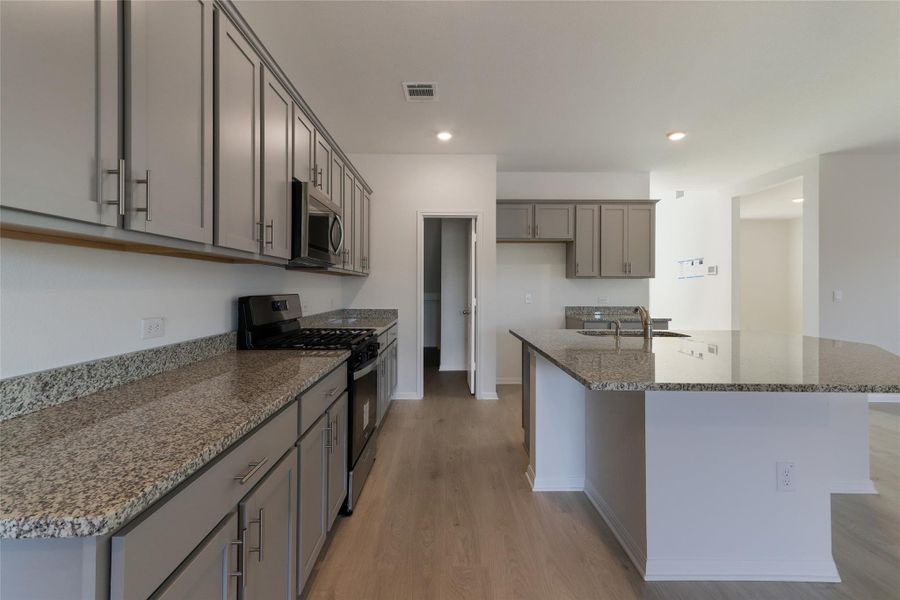 Furnished interior view inside a new home in Bar W Ranch, Leander (Image 8). Furnished interior view inside a new home in Bar W Ranch, Leander (Image 8).