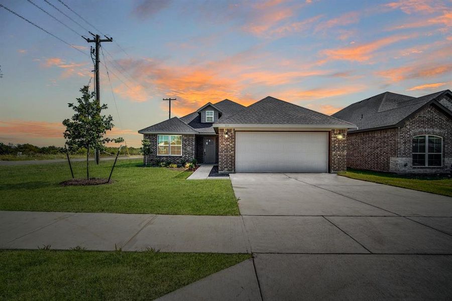 Front exterior of a new home in , Corsicana, TX, highlighting curb appeal (Image 15).