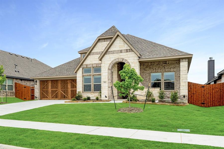 Front exterior of a new home in The Retreat at North Grove 60, Waxahachie, TX, highlighting curb appeal (Image 2). Front exterior of a new home in The Retreat at North Grove 60, Waxahachie, TX, highlighting curb appeal (Image 2).