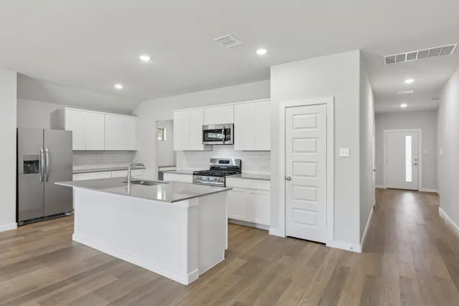 Kitchen in the Harrison home plan by Trophy Signature Homes – REPRESENTATIVE PHOTO Kitchen in the Harrison home plan by Trophy Signature Homes – REPRESENTATIVE PHOTO