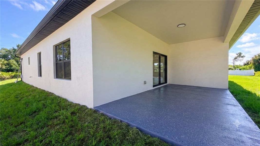 Exterior details and patio area of a home in , North Port (Image 19).