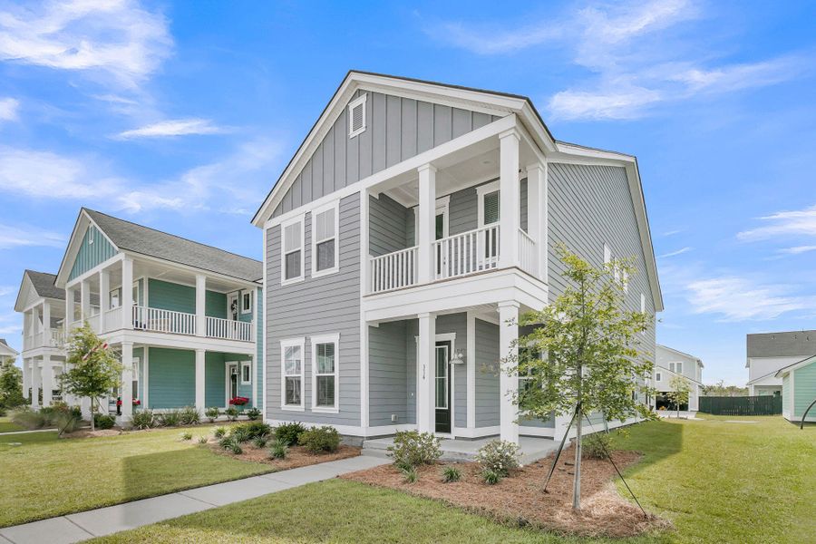 Front exterior of a new home in Carnes Crossroads, Summerville, SC, highlighting curb appeal (Image 2). Front exterior of a new home in Carnes Crossroads, Summerville, SC, highlighting curb appeal (Image 2).