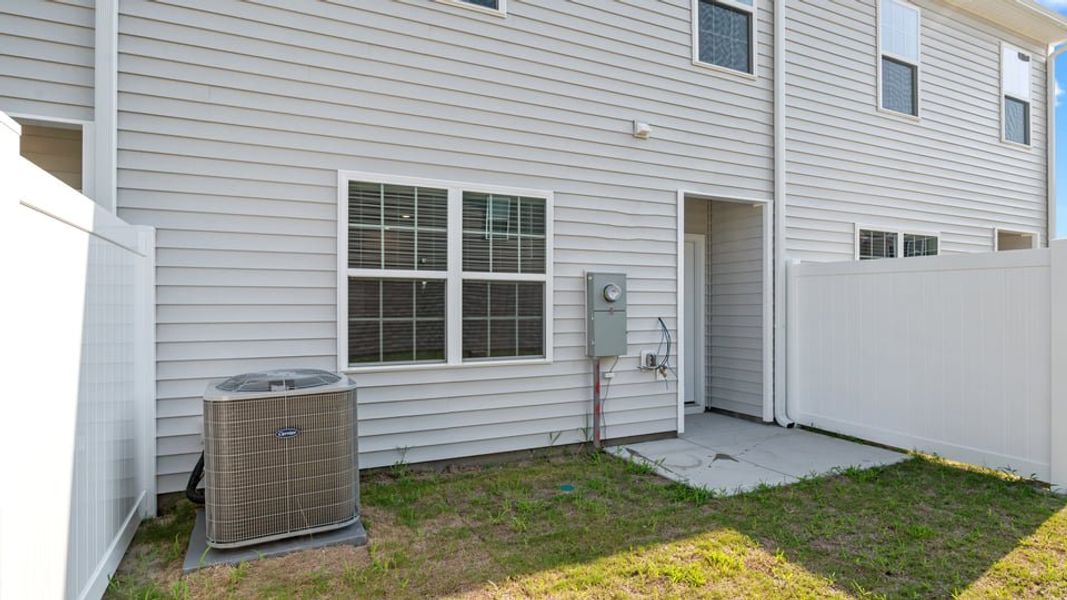 Exterior details and patio area of a home in The Townes at Ridgewood Farms, Winterville (Image 3).
