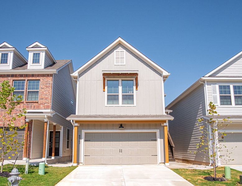 Representative exterior photo of a completed home built from the The Palmer by Rosehaven Homes in Magnolia Village, San Antonio, TX (Image 1).