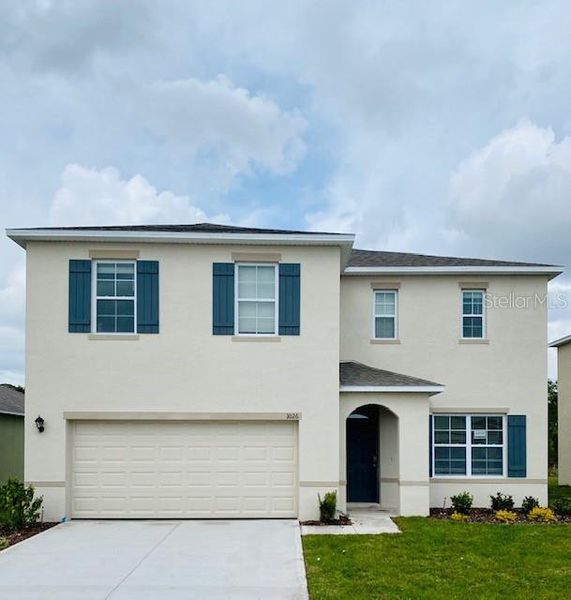 Front exterior of a new home in Concorde, Sanford, FL, highlighting curb appeal (Image 1).