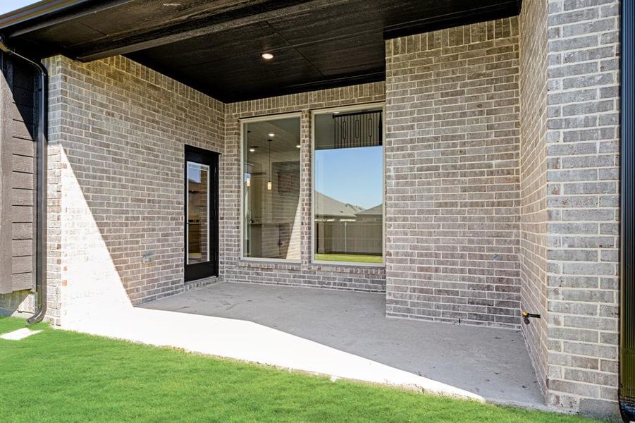 Exterior details and patio area of a home in Bear Creek Classic 50, Lavon (Image 3).