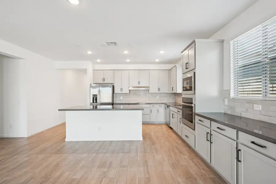 Dining and gourmet kitchen featuring the Foundry Collection. Finishes and options may vary.