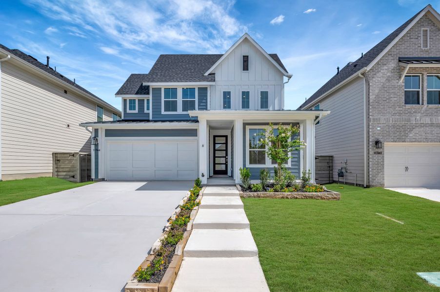 Front exterior of a new home in Treeline, Justin, TX, highlighting curb appeal (Image 1). Front exterior of a new home in Treeline, Justin, TX, highlighting curb appeal (Image 1).