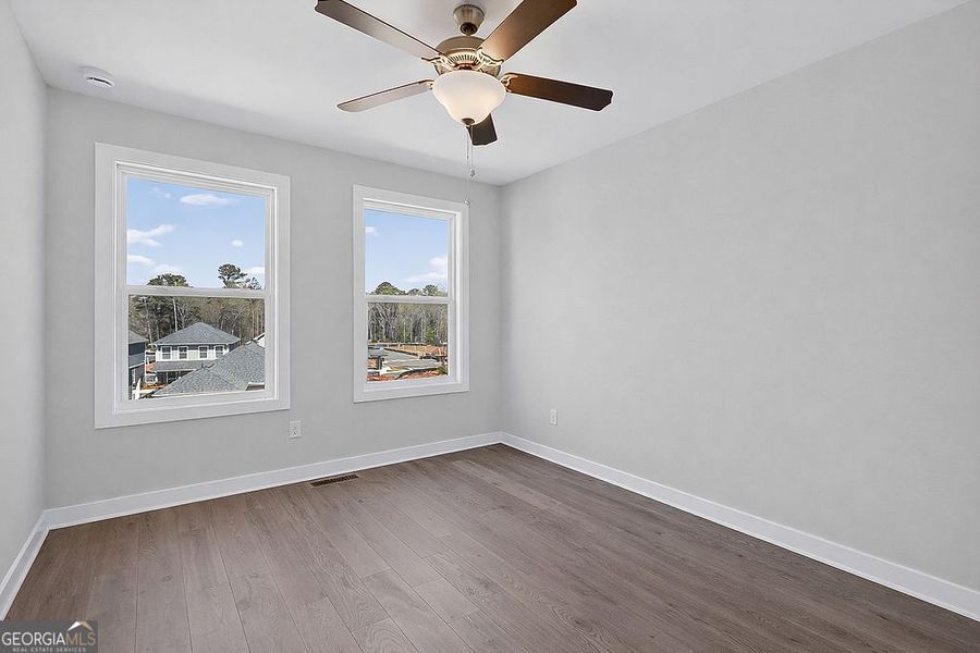 Spacious, unfurnished interior of a new home in The Cottages at East Lanier, Fayetteville (Image 14).