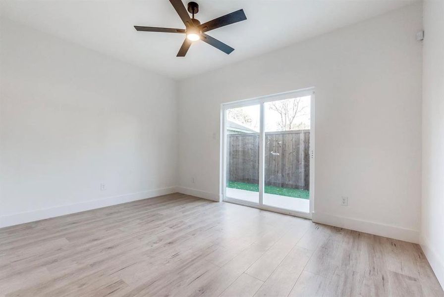 Spare room featuring ceiling fan and light hardwood / wood-style floors