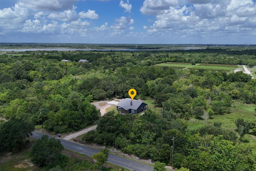 Overhead view of the front of the home. Property backs up to an orchard and Galveston Bay! Overhead view of the front of the home. Property backs up to an orchard and Galveston Bay!