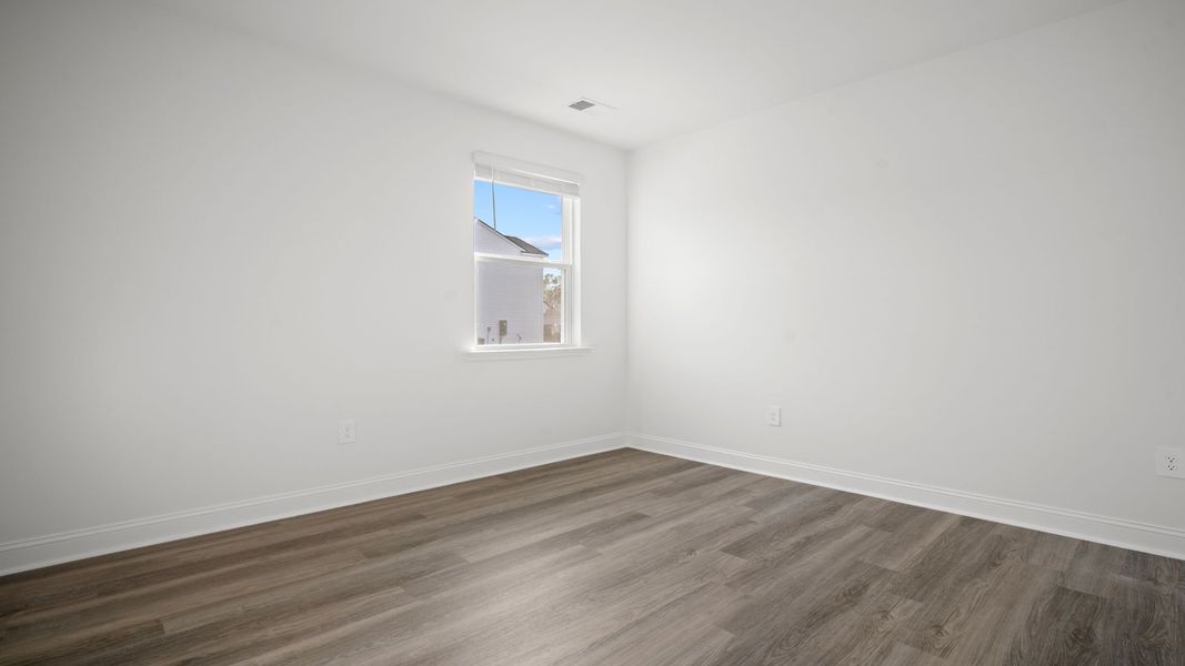Representative unfurnished interior of a home built from the Hemingway-Exp by D.R. Horton in The Lakes at North Glynn, Brunswick (Image 23).