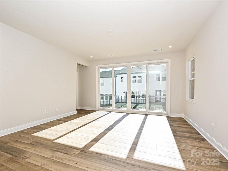 Great Room Seeped in Natural Light Through Sliding Doors to Outdoor Living. Great Room Seeped in Natural Light Through Sliding Doors to Outdoor Living.