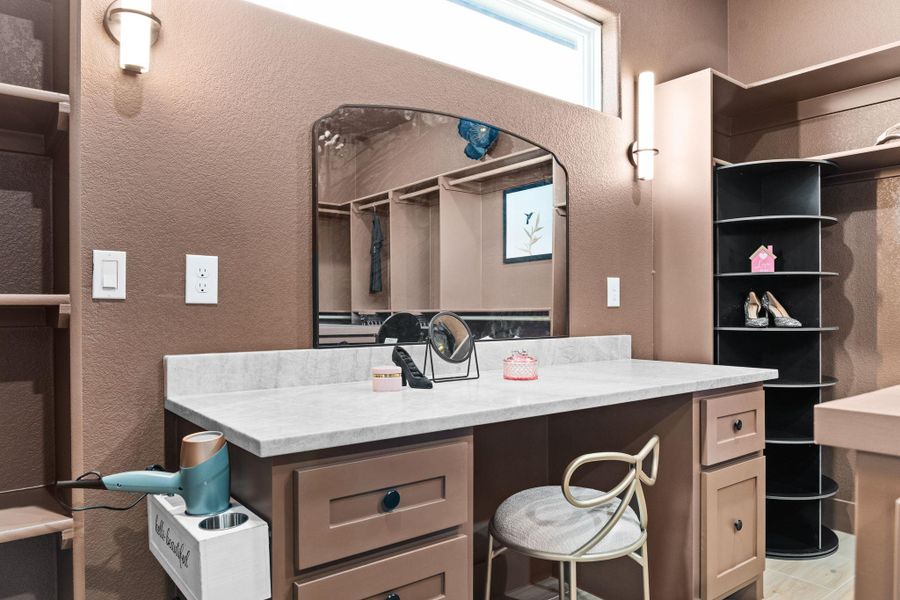 Bathroom featuring a textured wall Bathroom featuring a textured wall