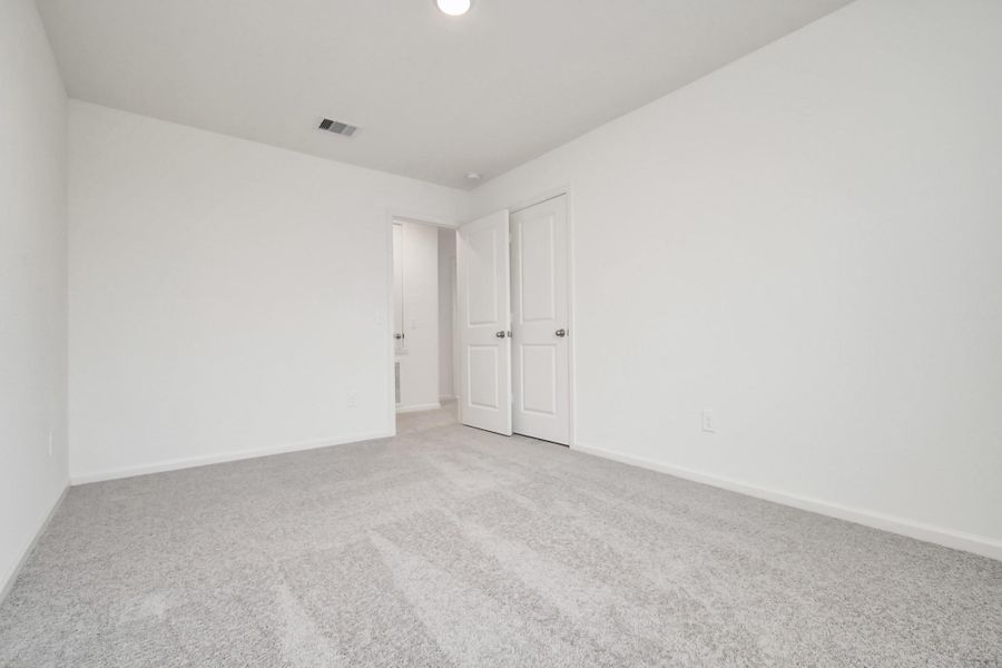 Spacious, unfurnished interior of a new home in Sunterra, Katy (Image 32).