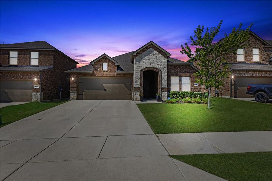 Front exterior of a new home in , Aubrey, TX, highlighting curb appeal (Image 2).