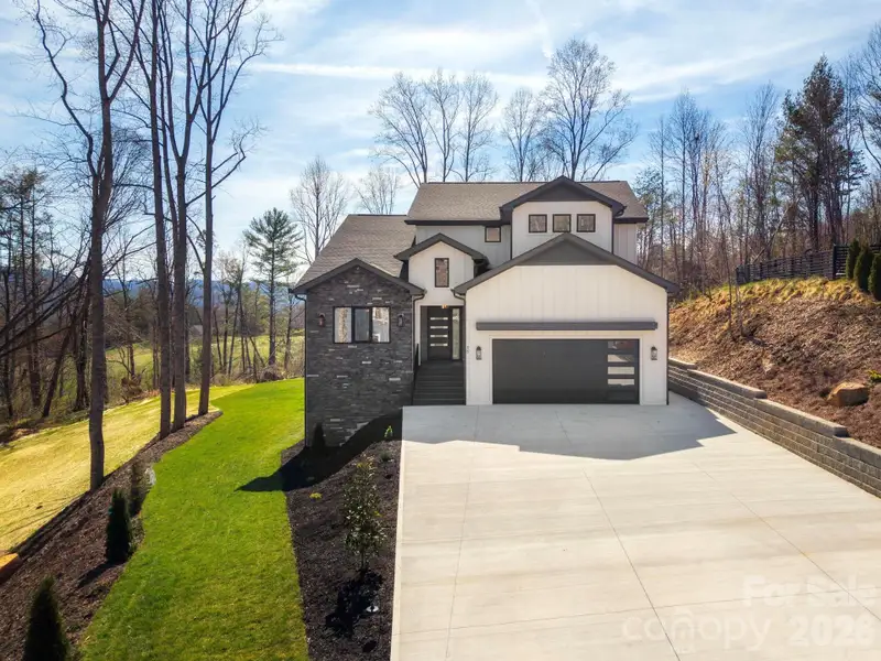 Front exterior of a new home in , Weaverville, NC, highlighting curb appeal (Image 21).