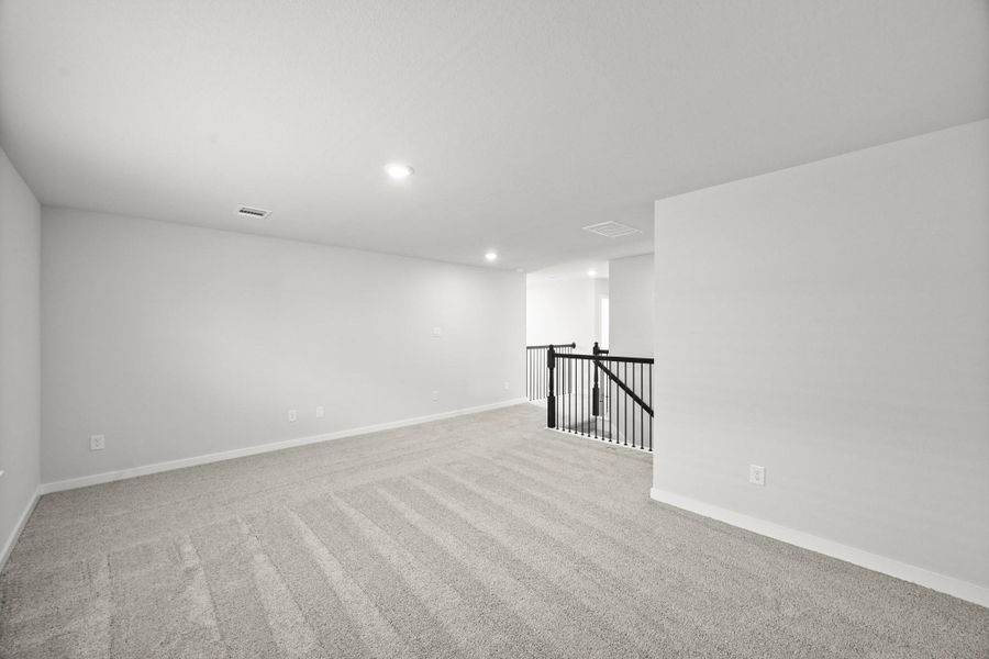 Spacious, unfurnished interior of a new home in Sunterra, Katy (Image 30).