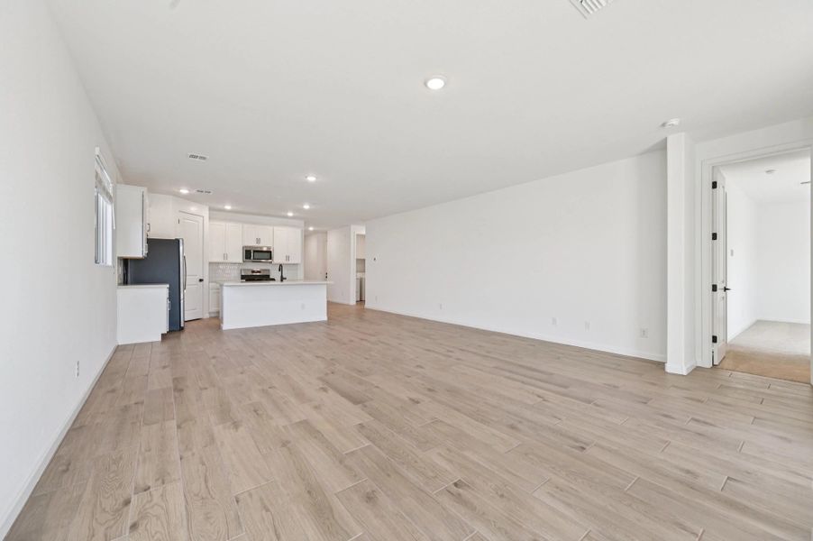 Great room, dining and kitchen. Not actual home, finishes may vary. Great room, dining and kitchen. Not actual home, finishes may vary.