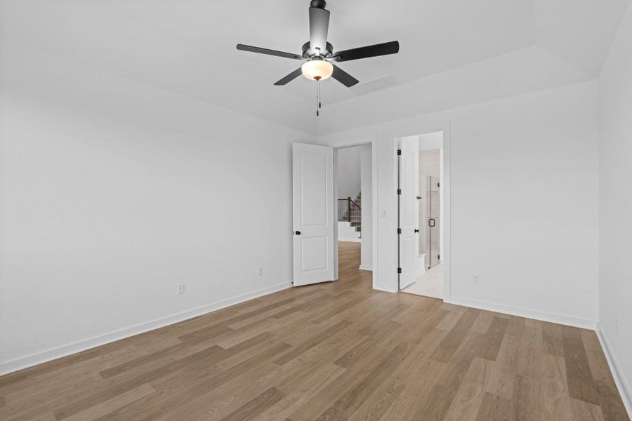 Primary Bedroom with elevated ceiling