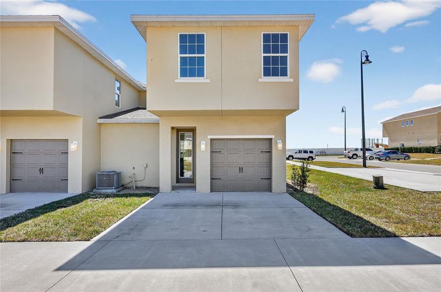 Front exterior of a new home in , Davenport, FL, highlighting curb appeal (Image 23).