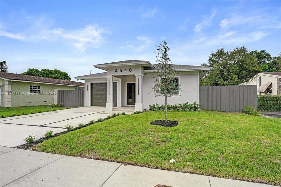 Front exterior of a new home in , West Park, FL, highlighting curb appeal (Image 28). Front exterior of a new home in , West Park, FL, highlighting curb appeal (Image 28).