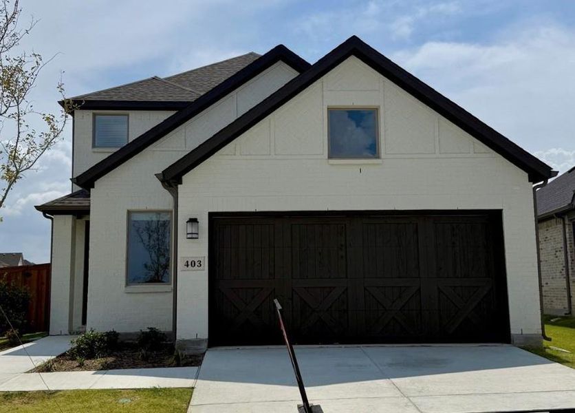 Front exterior of a new home in South Oak 40s, Lakewood Village, TX, highlighting curb appeal (Image 1). Front exterior of a new home in South Oak 40s, Lakewood Village, TX, highlighting curb appeal (Image 1).