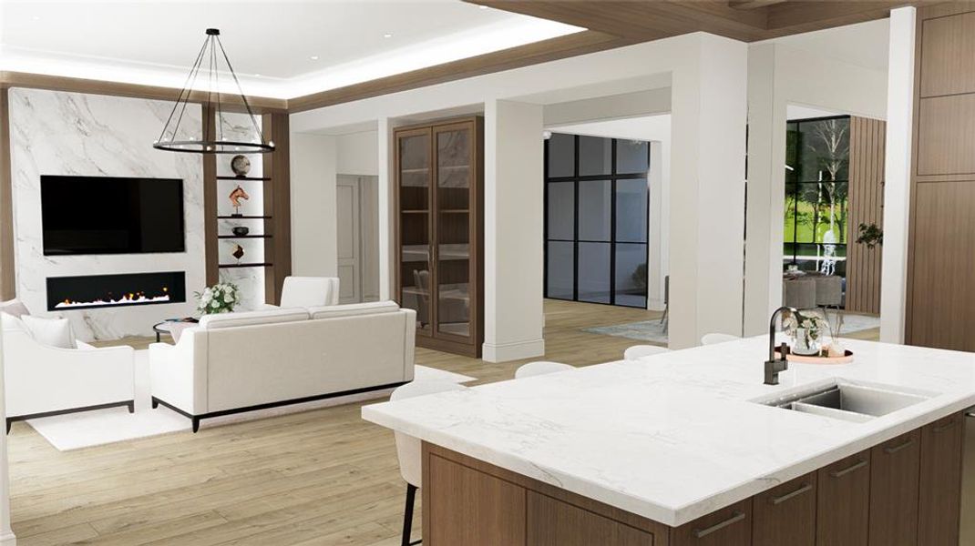 The great room opens up to the kitchen with expansive quartz island, Rohl fixtures and Frankie undermount sink with basin rack.