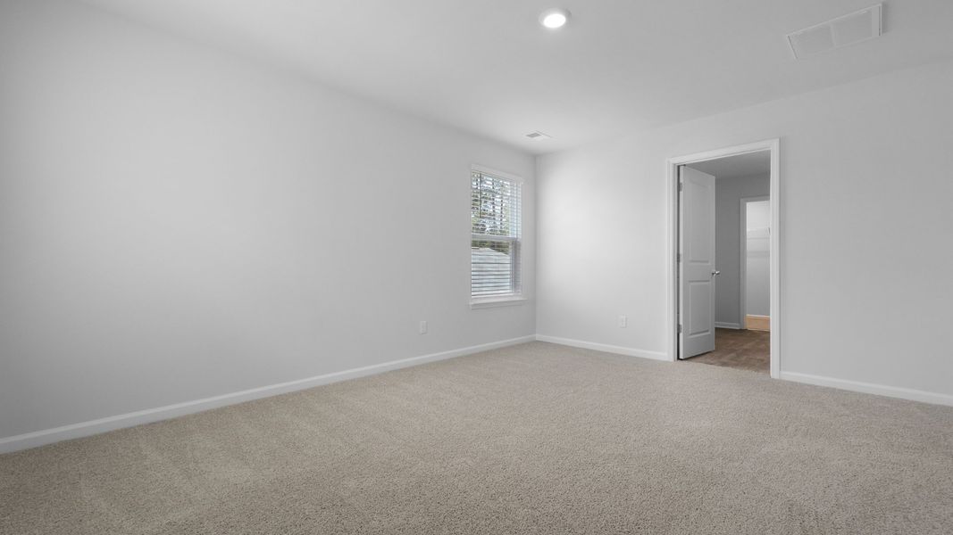 Representative unfurnished interior of a home built from the Aisle by D.R. Horton in Pine Hills at Cane Bay, Summerville (Image 26).