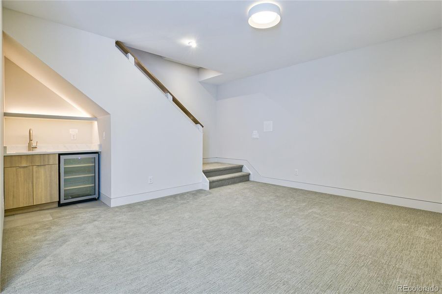 Wet Bar with Beverage Fridge. Cool Lighting!