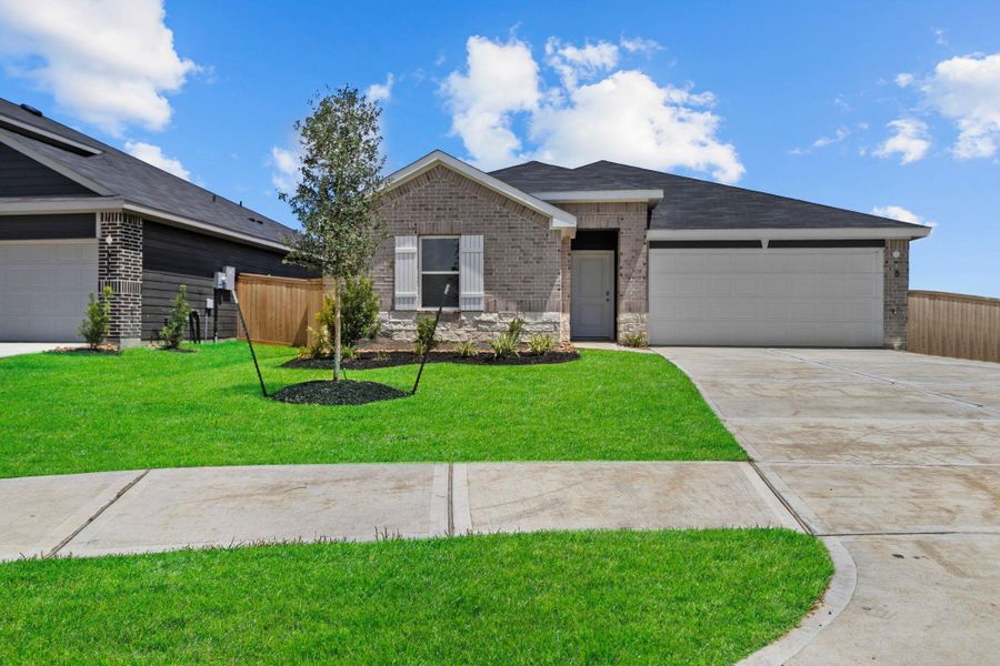 Front exterior of a new home in Maple Woods, Hockley, TX, highlighting curb appeal (Image 2). Front exterior of a new home in Maple Woods, Hockley, TX, highlighting curb appeal (Image 2).