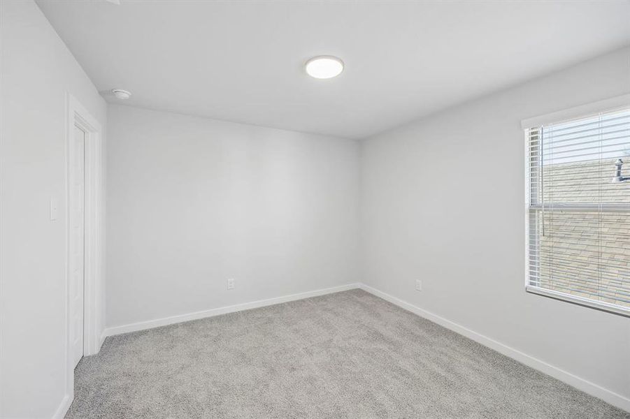 Bedroom in the Mesquite home plan by Trophy Signature Homes – REPRESENTATIVE PHOTO