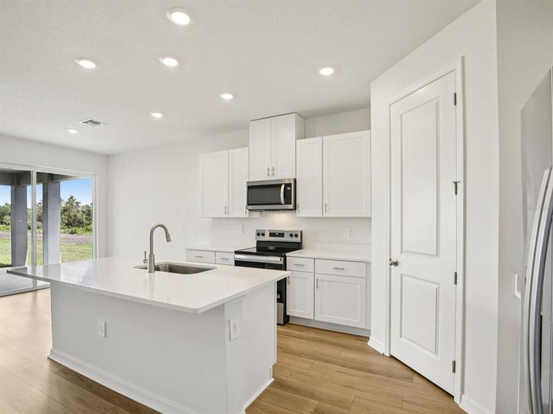 Furnished interior view inside a new home in Coasterra - Reserve Series, Palmetto (Image 8).