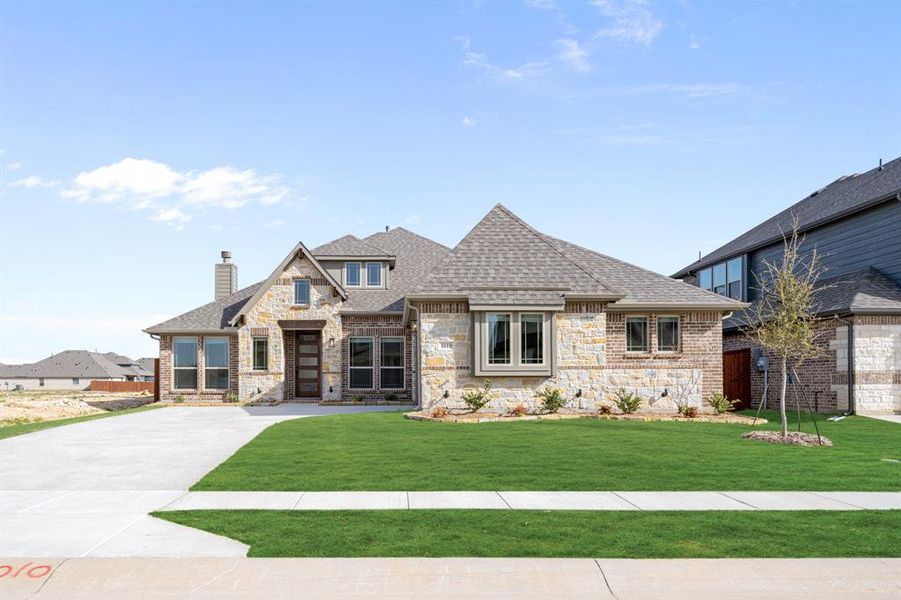 Front exterior of a new home in Timberbrook, Justin, TX, highlighting curb appeal (Image 19).
