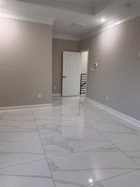 Elegant space with glossy, marble-like tile flooring and soft beige walls, offering a modern and inviting atmosphere. Elegant space with glossy, marble-like tile flooring and soft beige walls, offering a modern and inviting atmosphere.