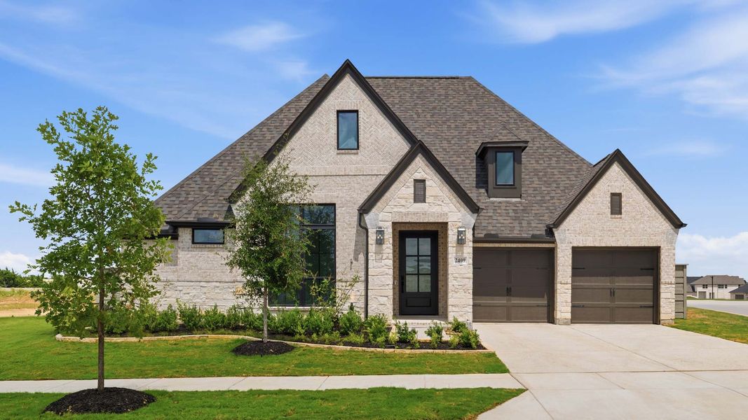 Front exterior of a new home in Ramble, Celina, TX, highlighting curb appeal (Image 1). Front exterior of a new home in Ramble, Celina, TX, highlighting curb appeal (Image 1).