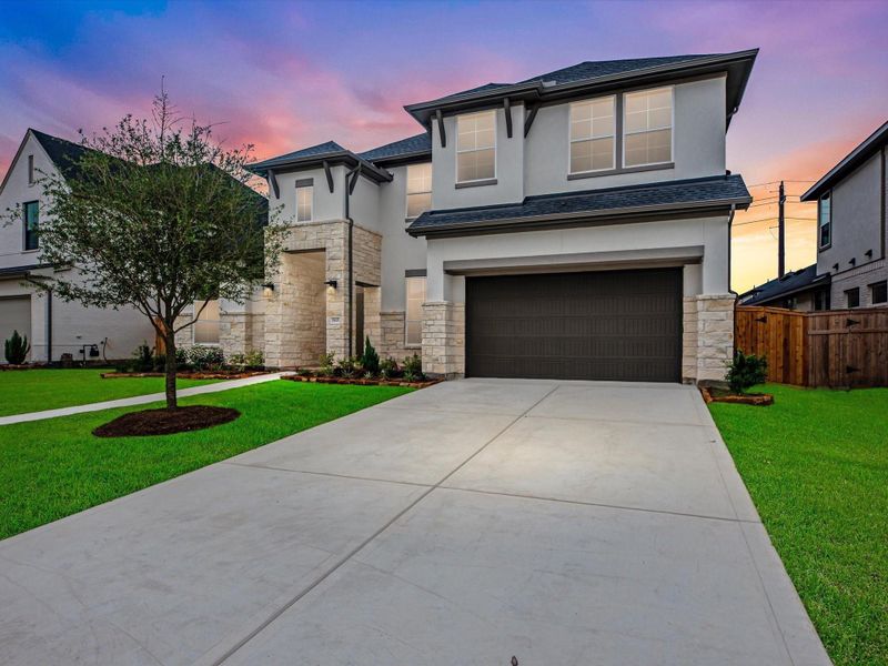 Front exterior of a new home in Cross Creek Ranch 65′, Fulshear, TX, highlighting curb appeal (Image 2). Front exterior of a new home in Cross Creek Ranch 65′, Fulshear, TX, highlighting curb appeal (Image 2).
