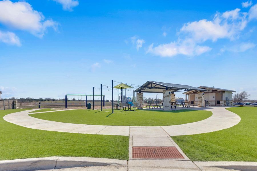 Community area featuring play ground, covered Pavillon, picnic tables, and restrooms.