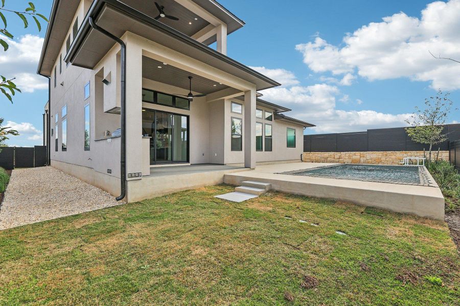 Rear view of house with a patio, a fenced backyard, and ceiling fan