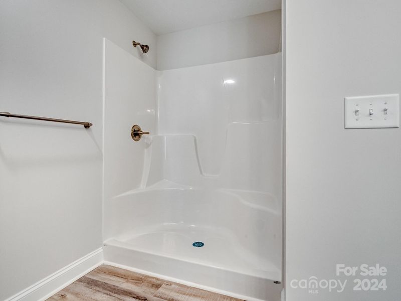 Walk-in shower in primary bathroom (bathtub in secondary bathroom)