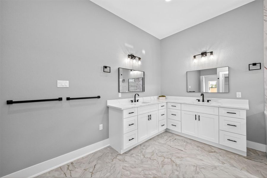 Large vanity area in primary bathroom. Large vanity area in primary bathroom.